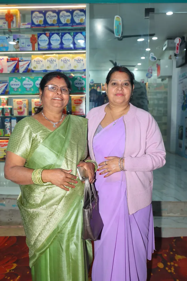 Guests share a cheerful moment inside the store. — Bhurbhura More, Deoghar