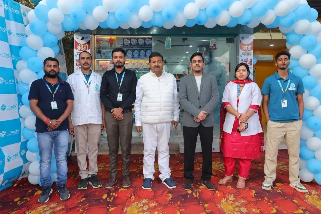 Guests pose together in front of the decorated entrance. — Bhurbhura More, Deoghar