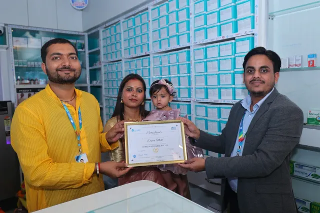 A certificate presentation marks a shared opening-day milestone. — Patepur road, Mahua