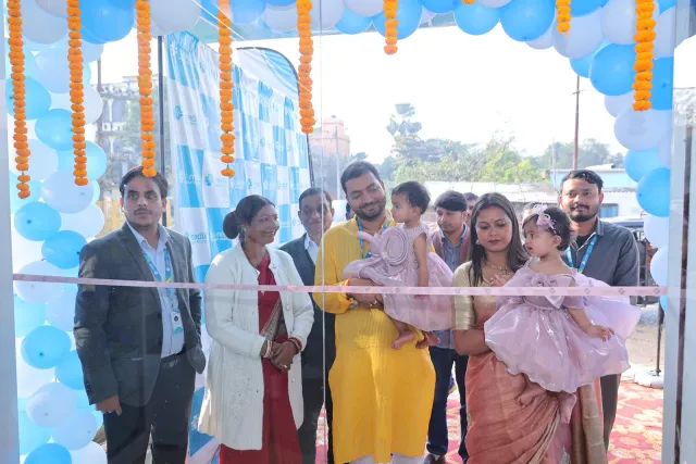 Families and guests gather around the opening ribbon. — Patepur road, Mahua