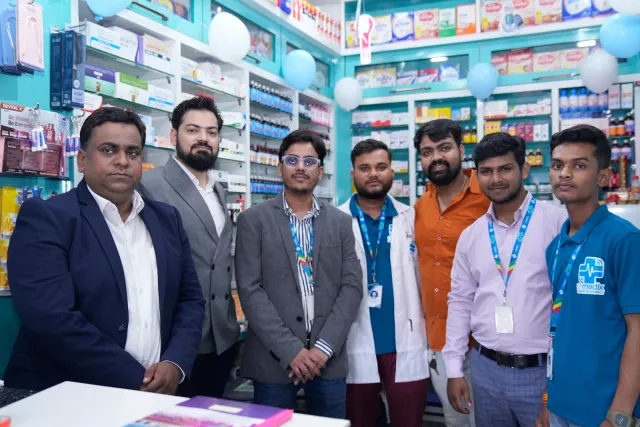 Guests and team members gather for a photograph inside the store. — Raxaul