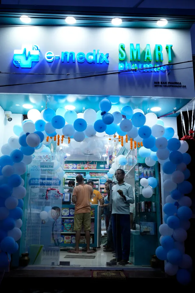 The illuminated Raxaul storefront welcomes evening visitors. — Raxaul