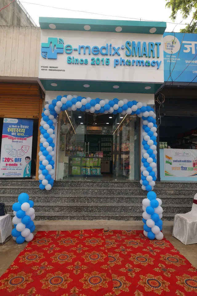 A red carpet leads to the balloon-framed Usri Bazar entrance. — Usri Bazar