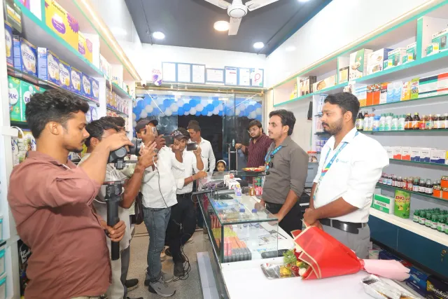 Phones capture another moment of conversation inside the store. — Usri Bazar