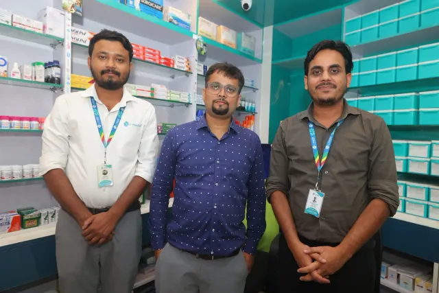 The pharmacy team poses together inside the store. — Usri Bazar