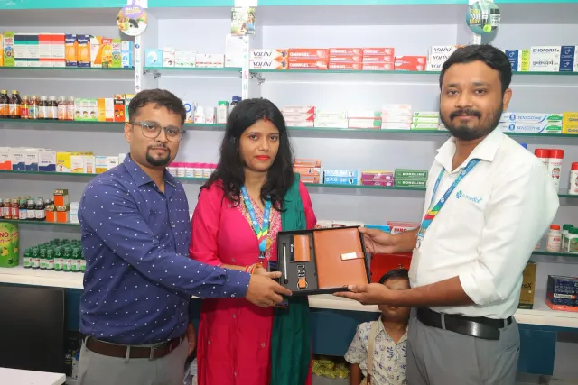A commemorative presentation celebrates the pharmacy's new chapter. — Usri Bazar
