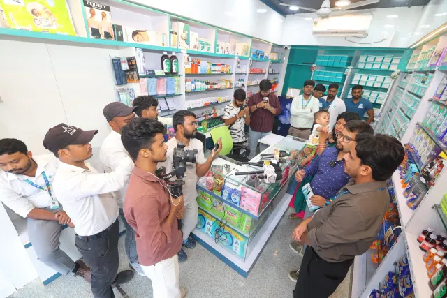 Guests gather at the counter during the opening celebrations. — Usri Bazar